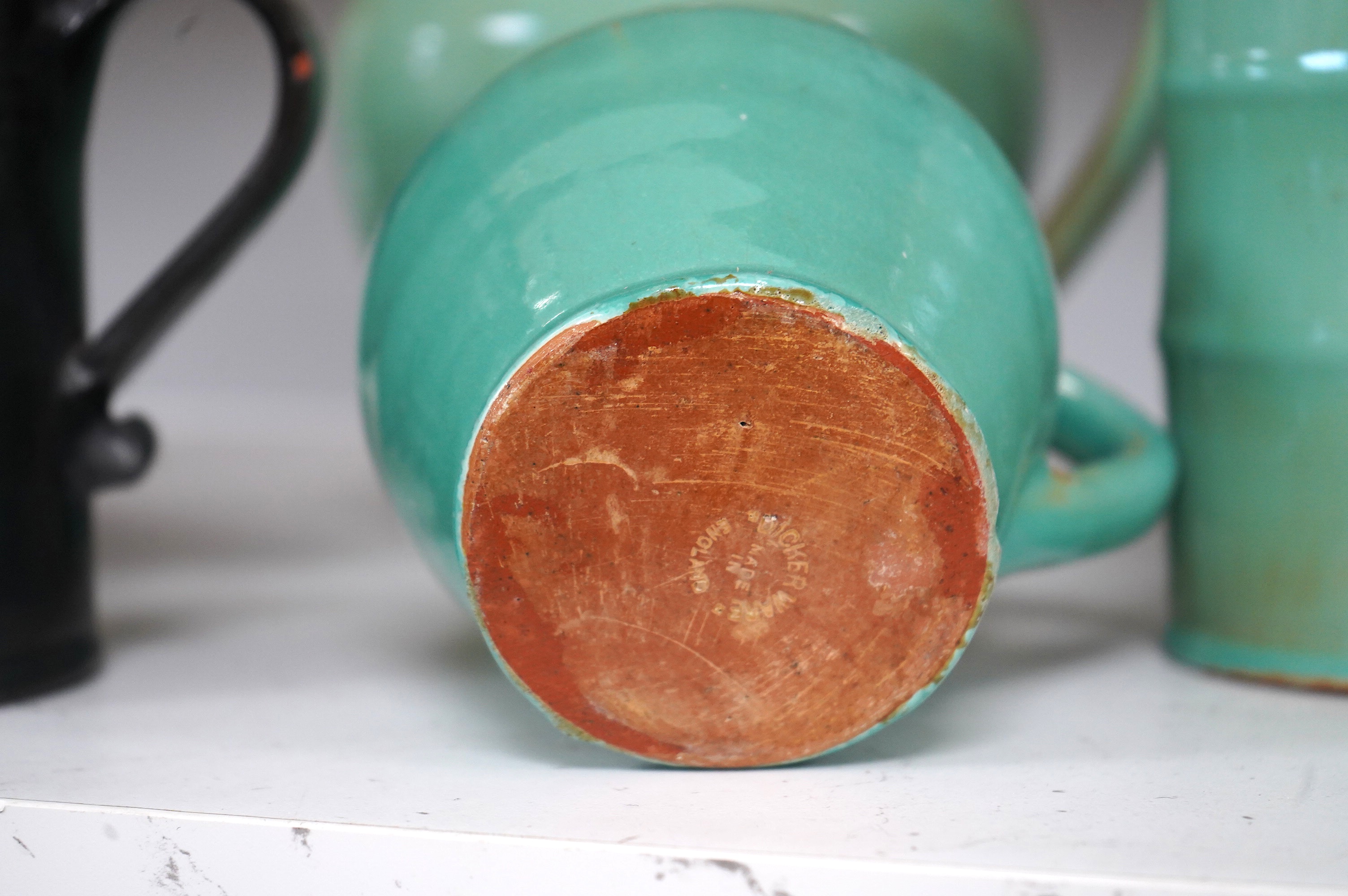 Ten items of Dickerware pottery, including a Uriah Clark and Nephew trio of connected jugs, tallest 21cm